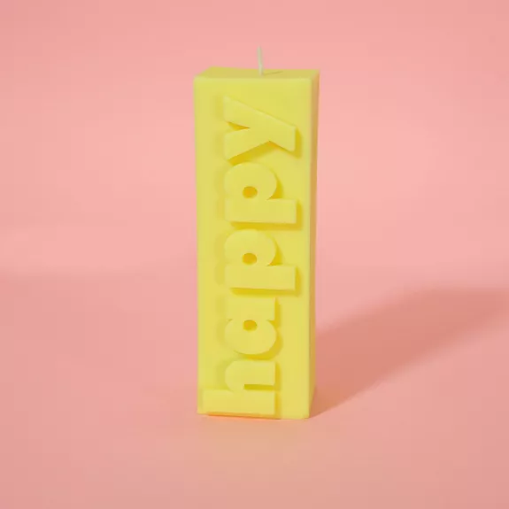 Bougie Happy jaune avec message en relief, ambiance joyeuse