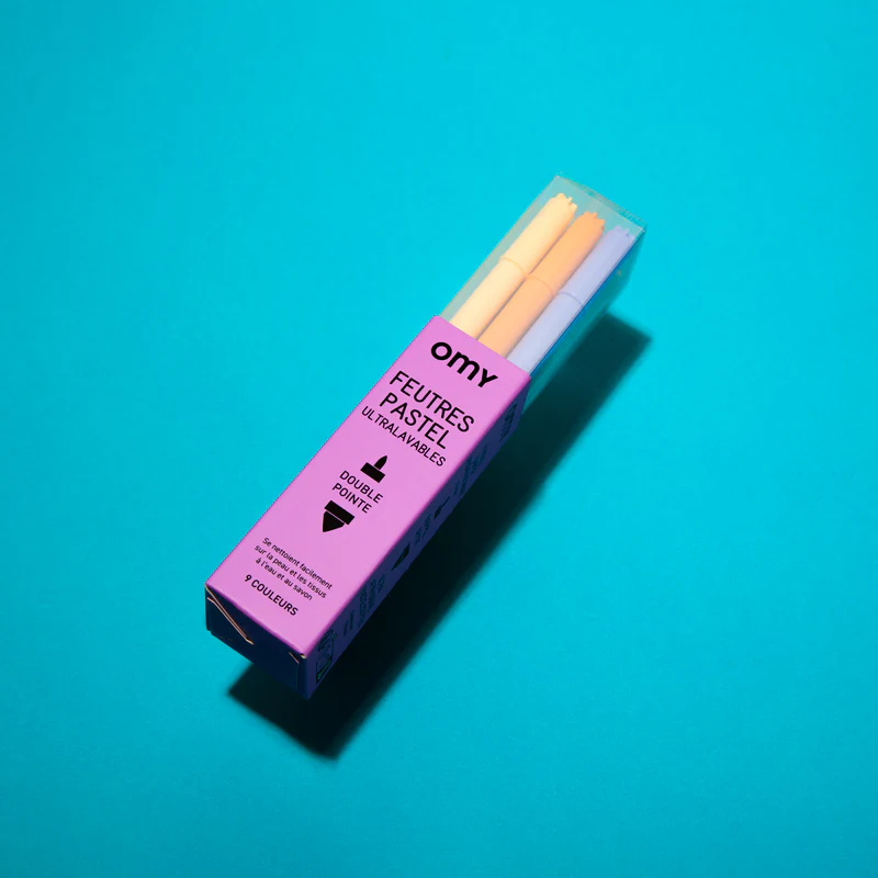 Feutres pastel double pointe OMY sur fond clair pour colorier