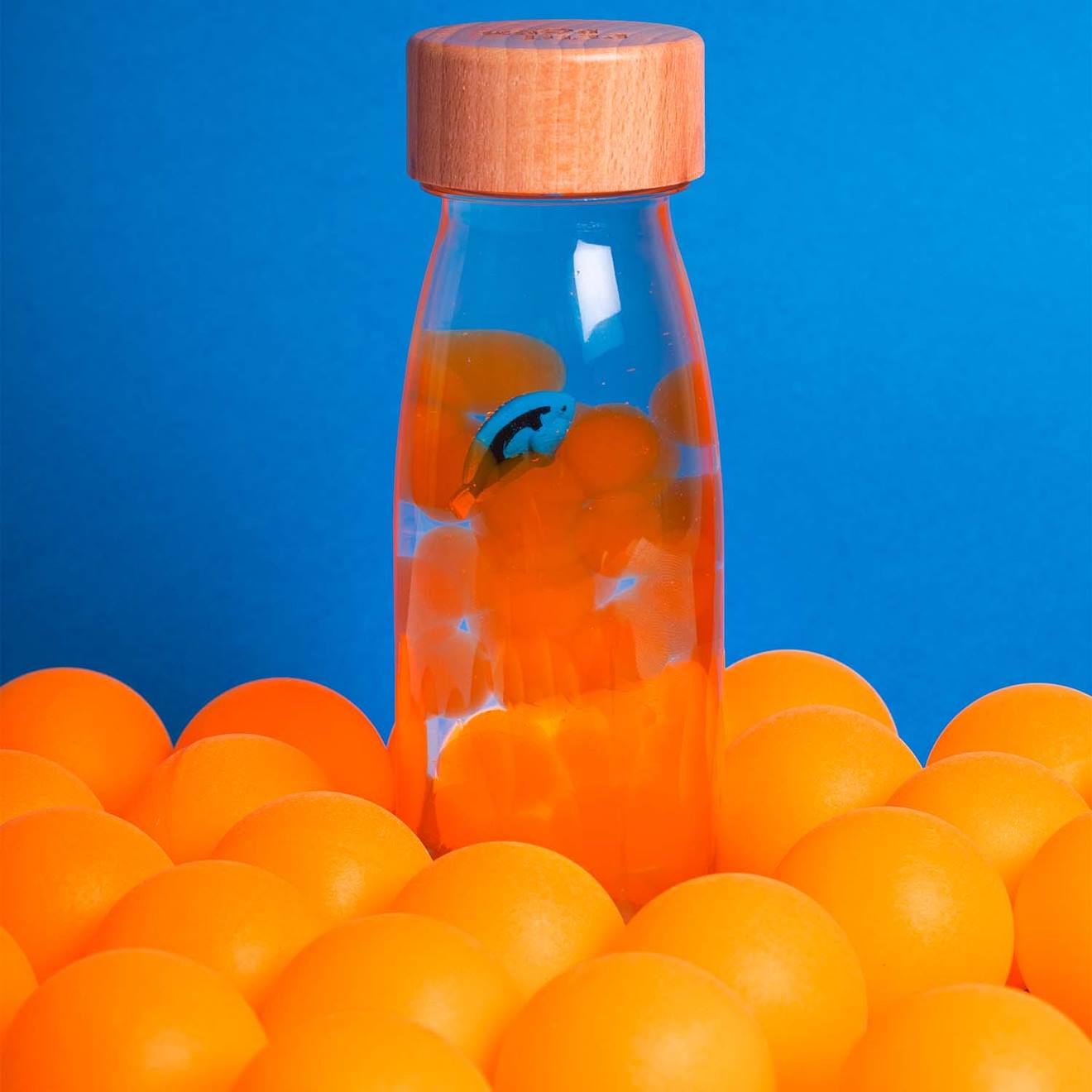 Bouteille sensorielle sound transparent, poisson orange