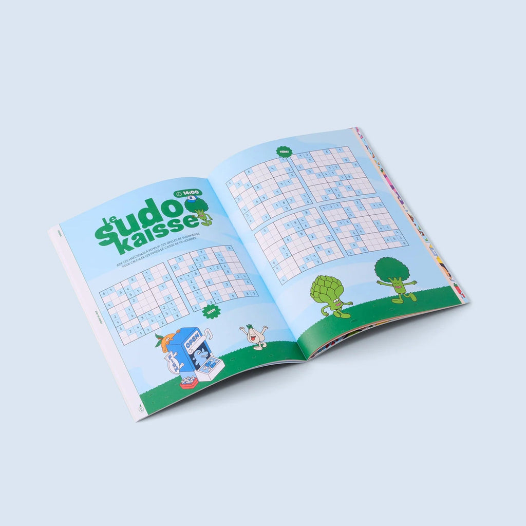 Cahier de jeux ouvert montrant des pages de défis