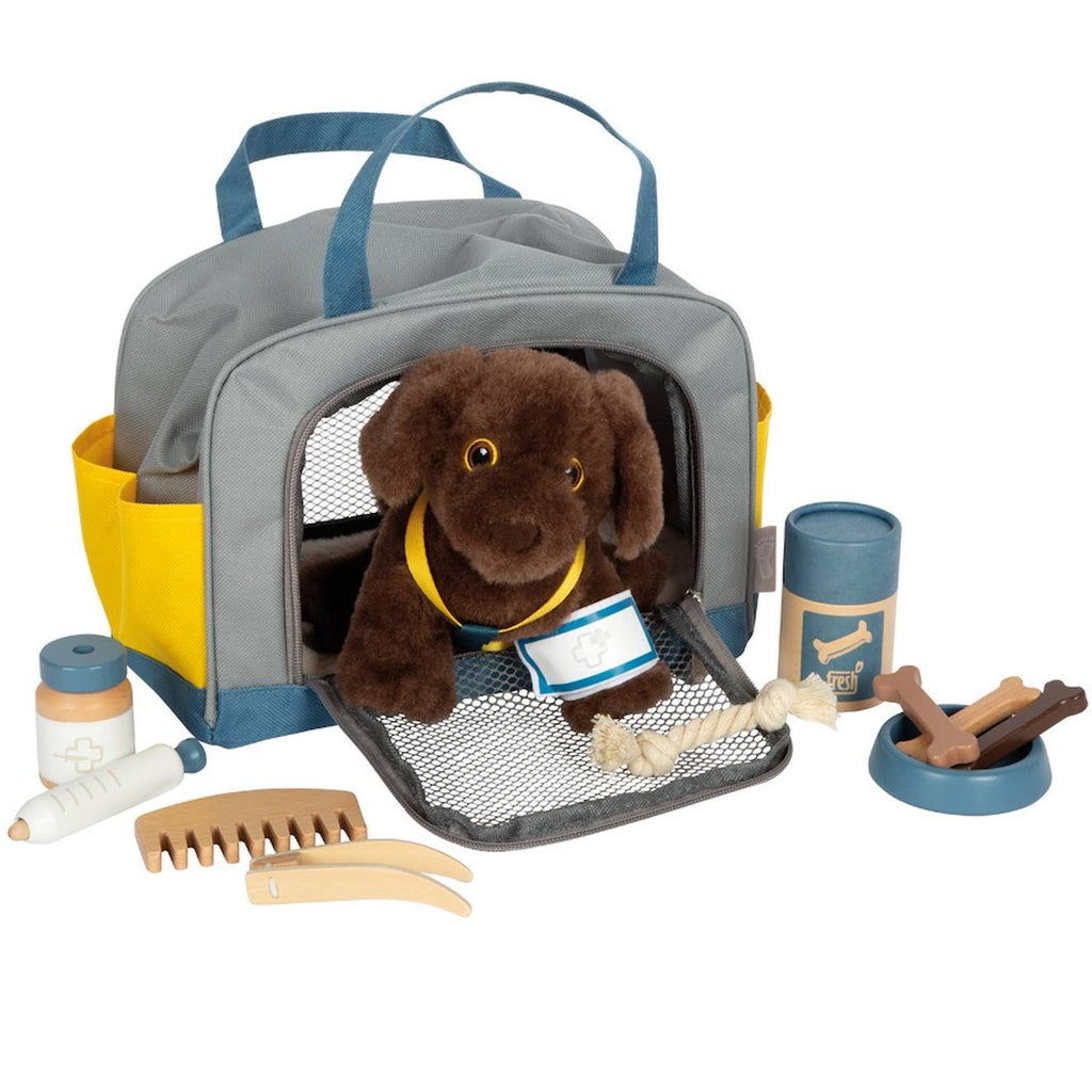 Chien avec sac et kit de soins gris