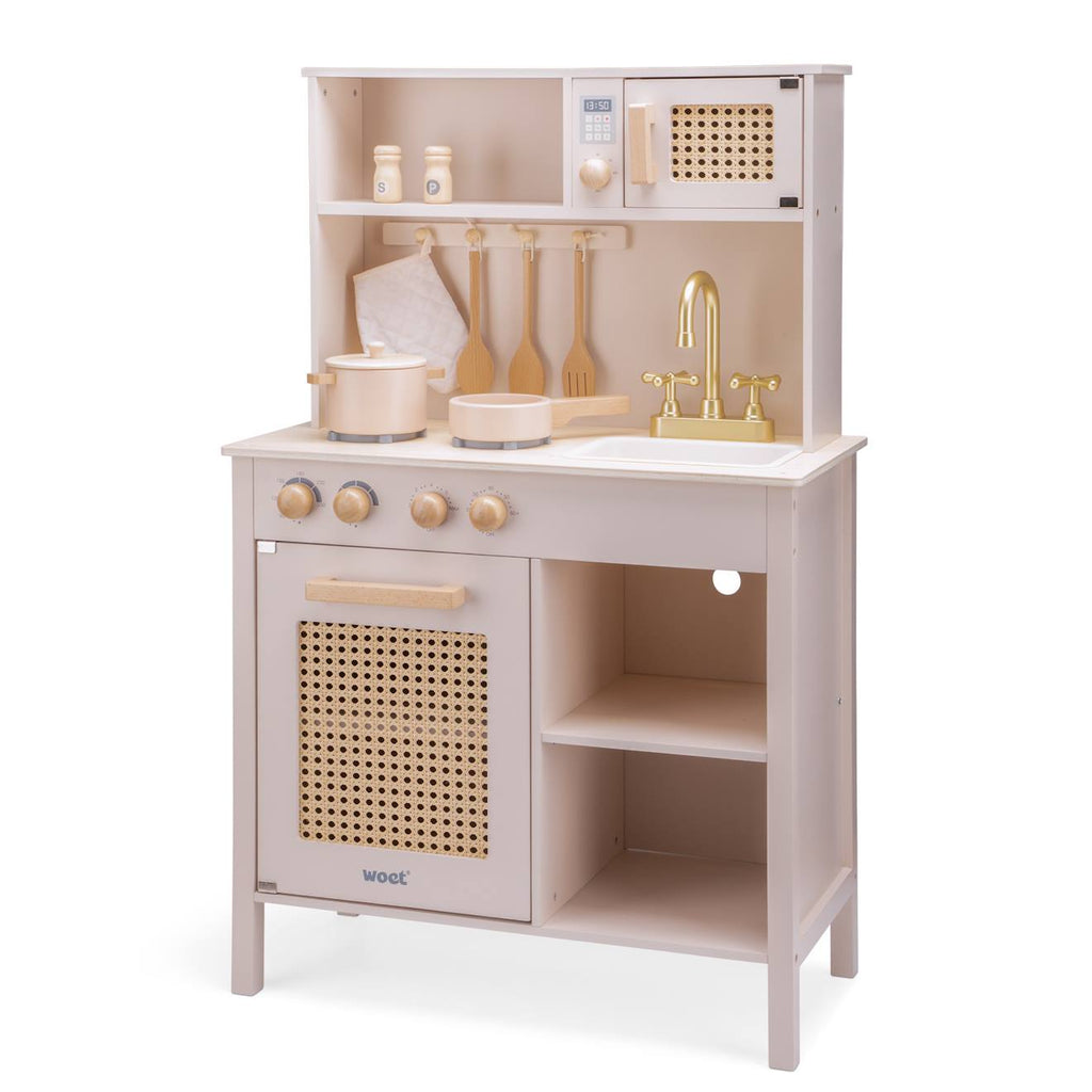 Cuisine en bois et rotin rose