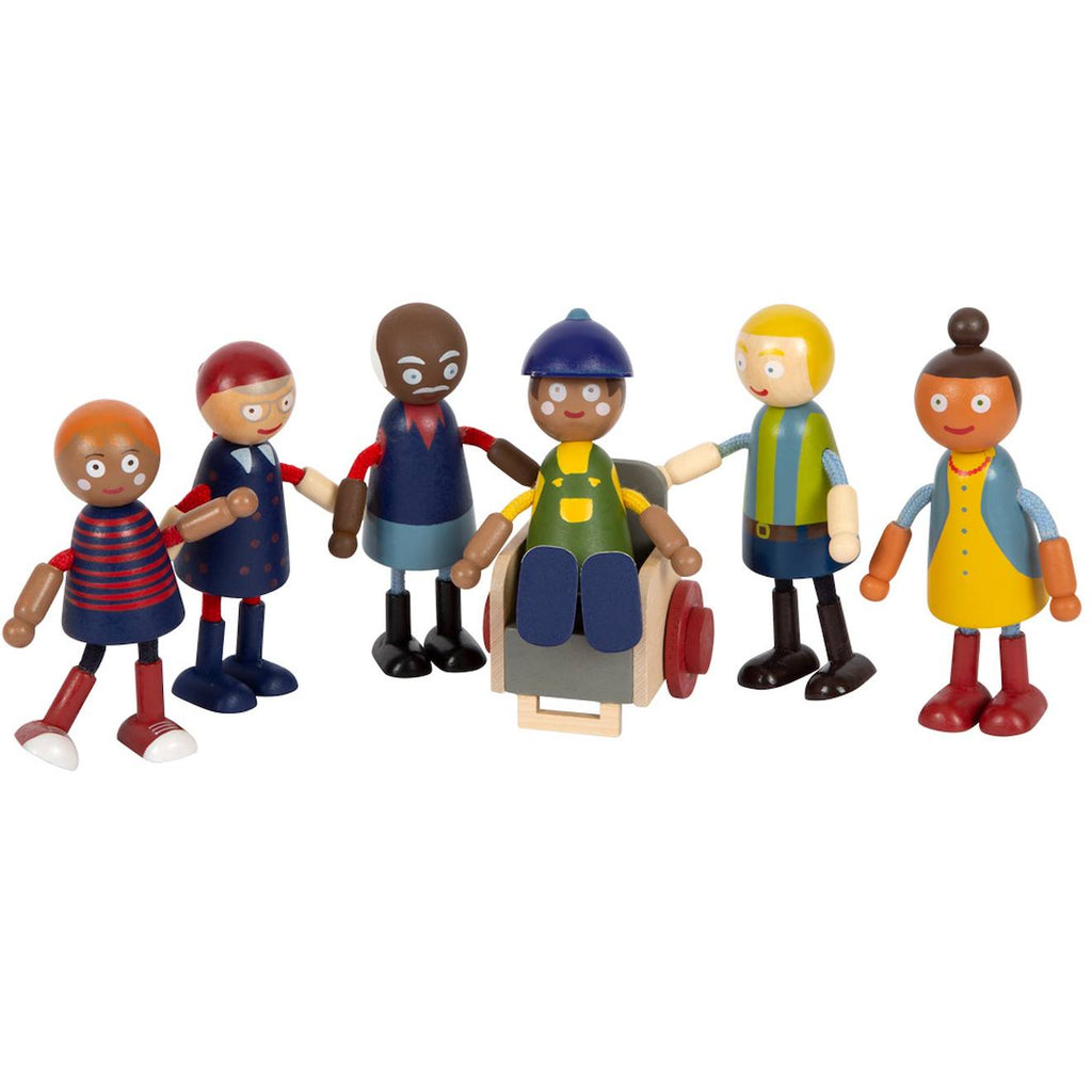 Famille de poupées avec fauteuil roulant beige