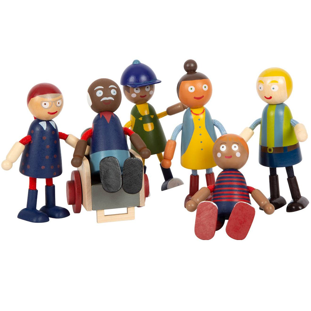 Famille de poupées avec fauteuil roulant beige