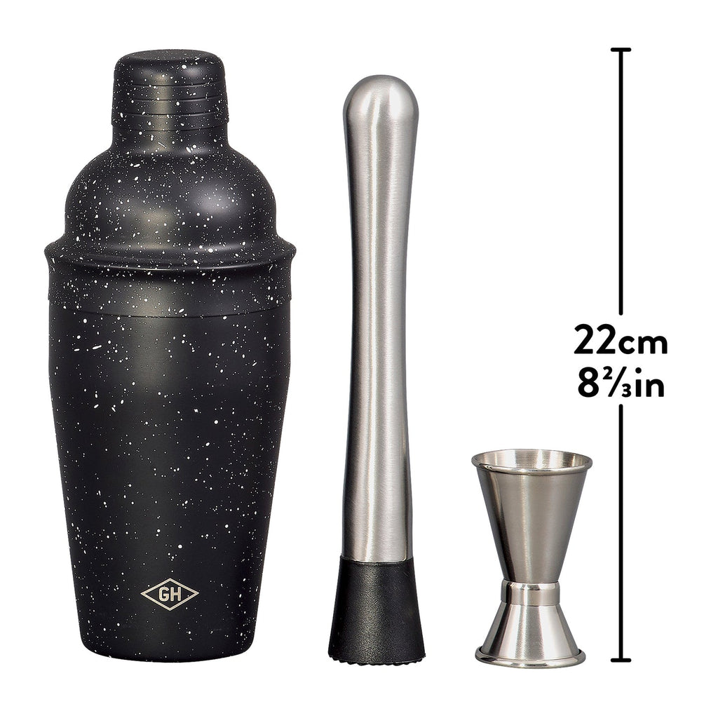 Outils de mixologie en acier inoxydable sur fond clair
