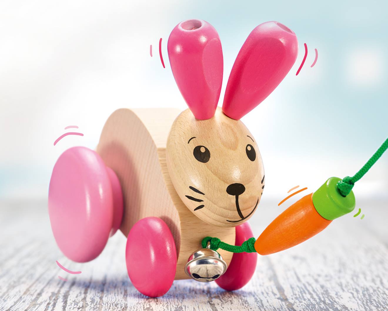 Lapin en bois massif à tirer rose