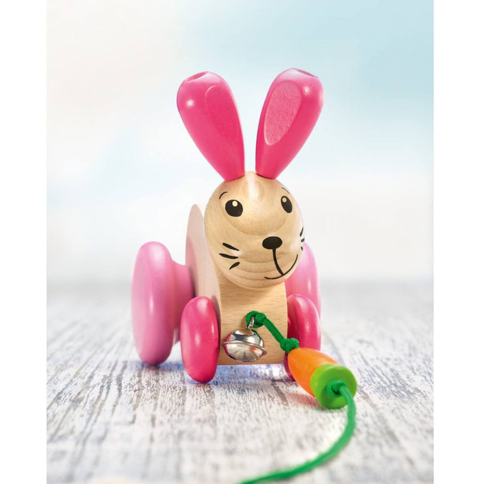 Lapin en bois massif à tirer rose