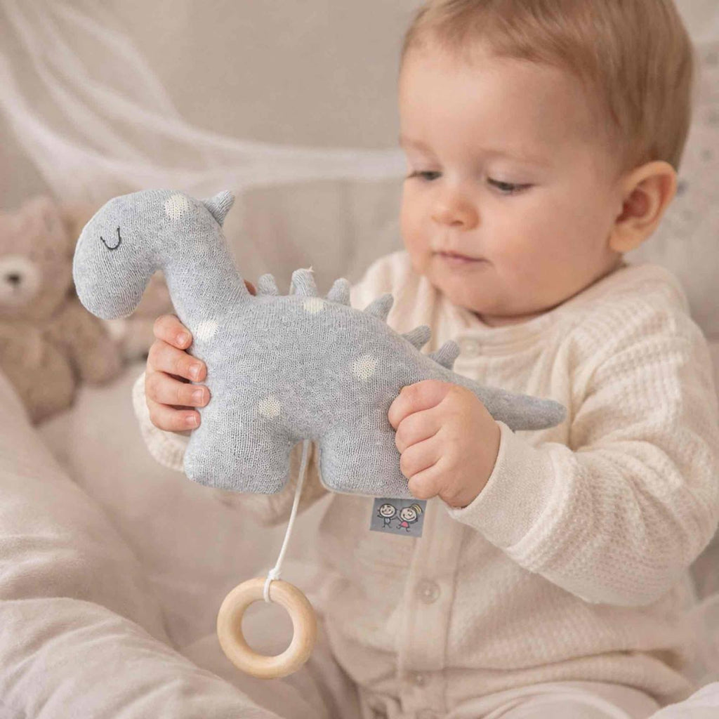 Peluche musicale en tricot de coton dino dino gris