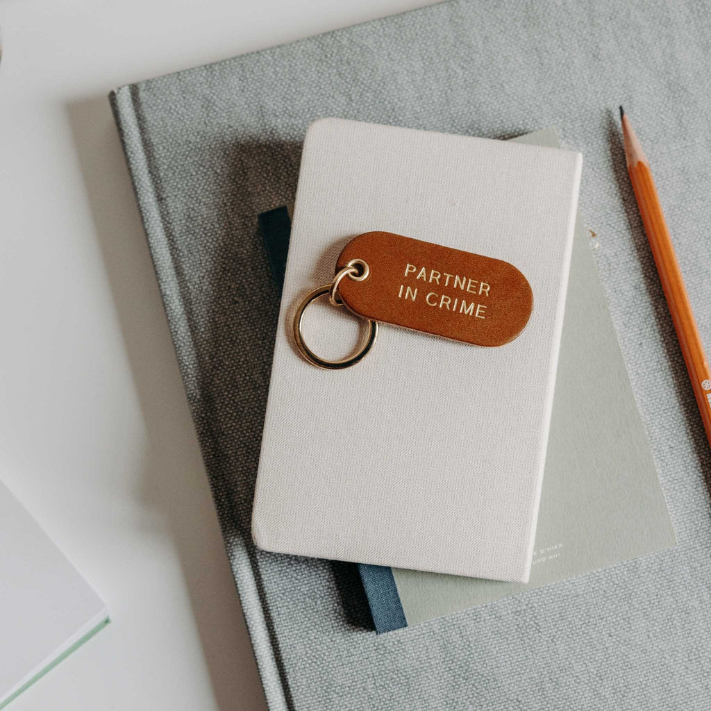 Porte-clé à message en cuir