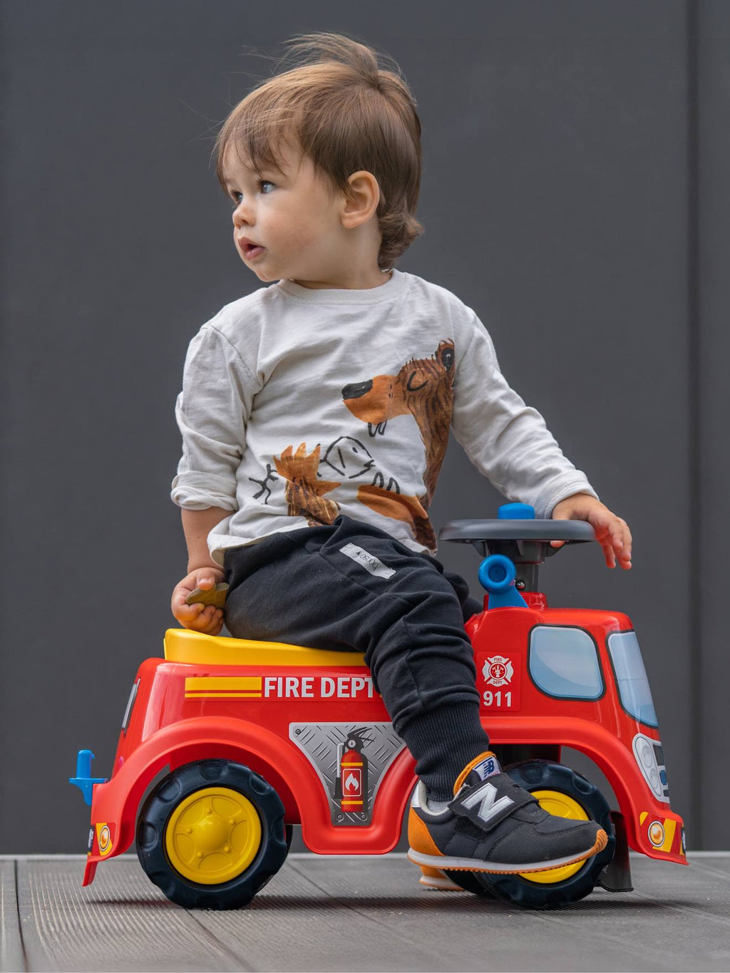 Porteur avec assise ouvrante et volant directionnel avec klaxon rouge