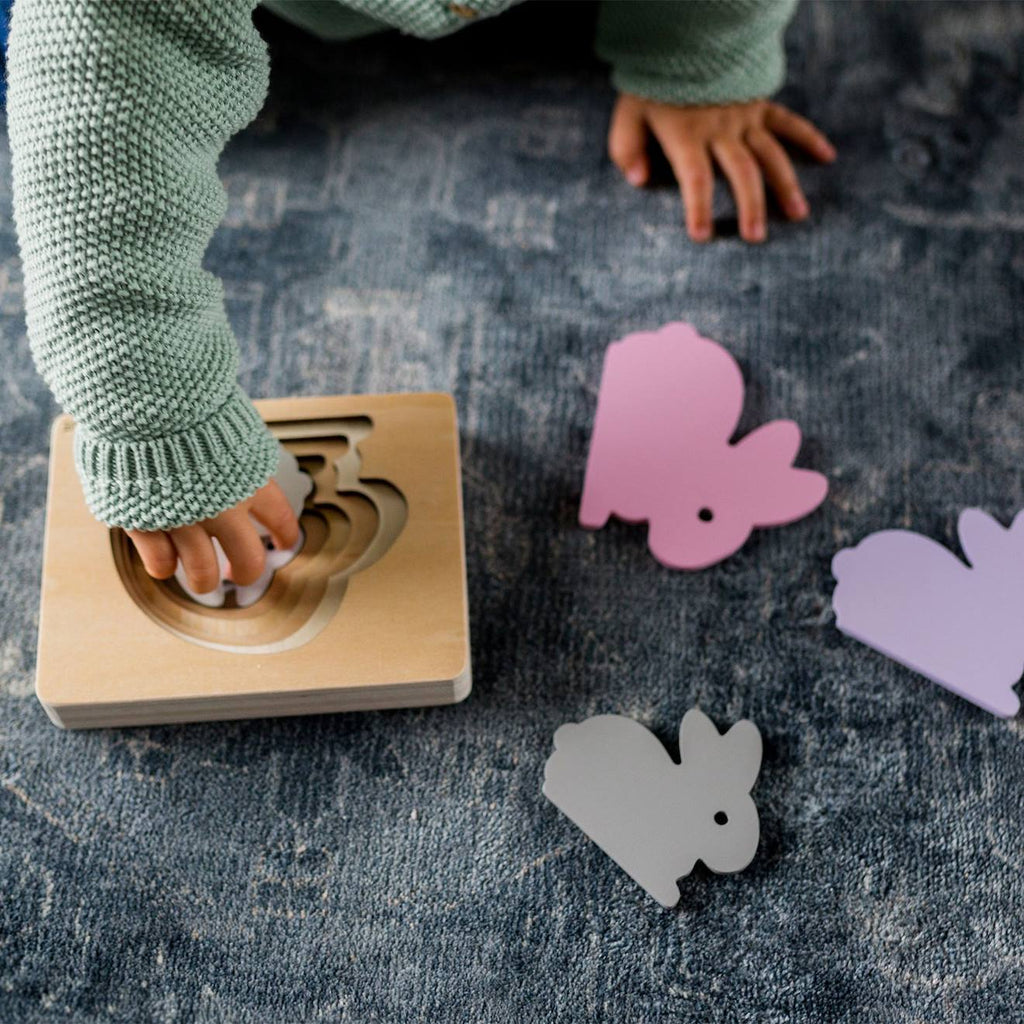 Puzzle animal en bois rose pâle