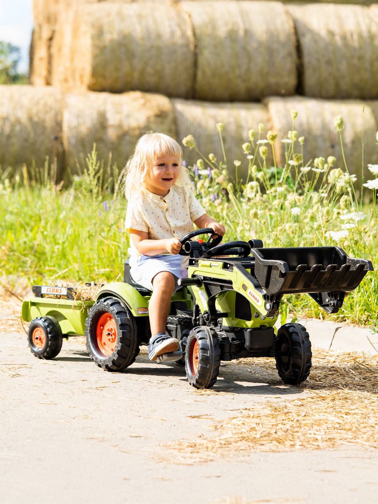Tractopelle à pédales avec remorque vert claas